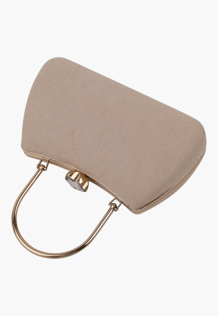 Close-up detail of a beige handbag showcasing gold hardware and clasp closure.