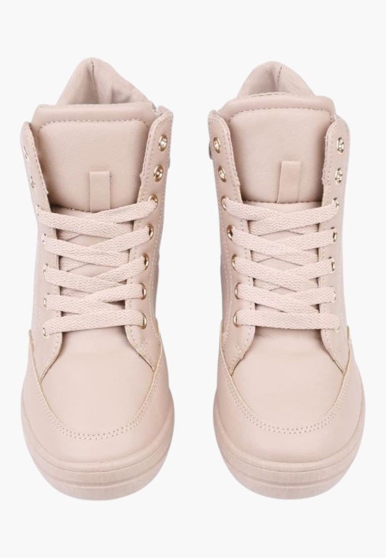 Przednie ujęcie beżowych sneakersów damskich z okrągłym noskiem.