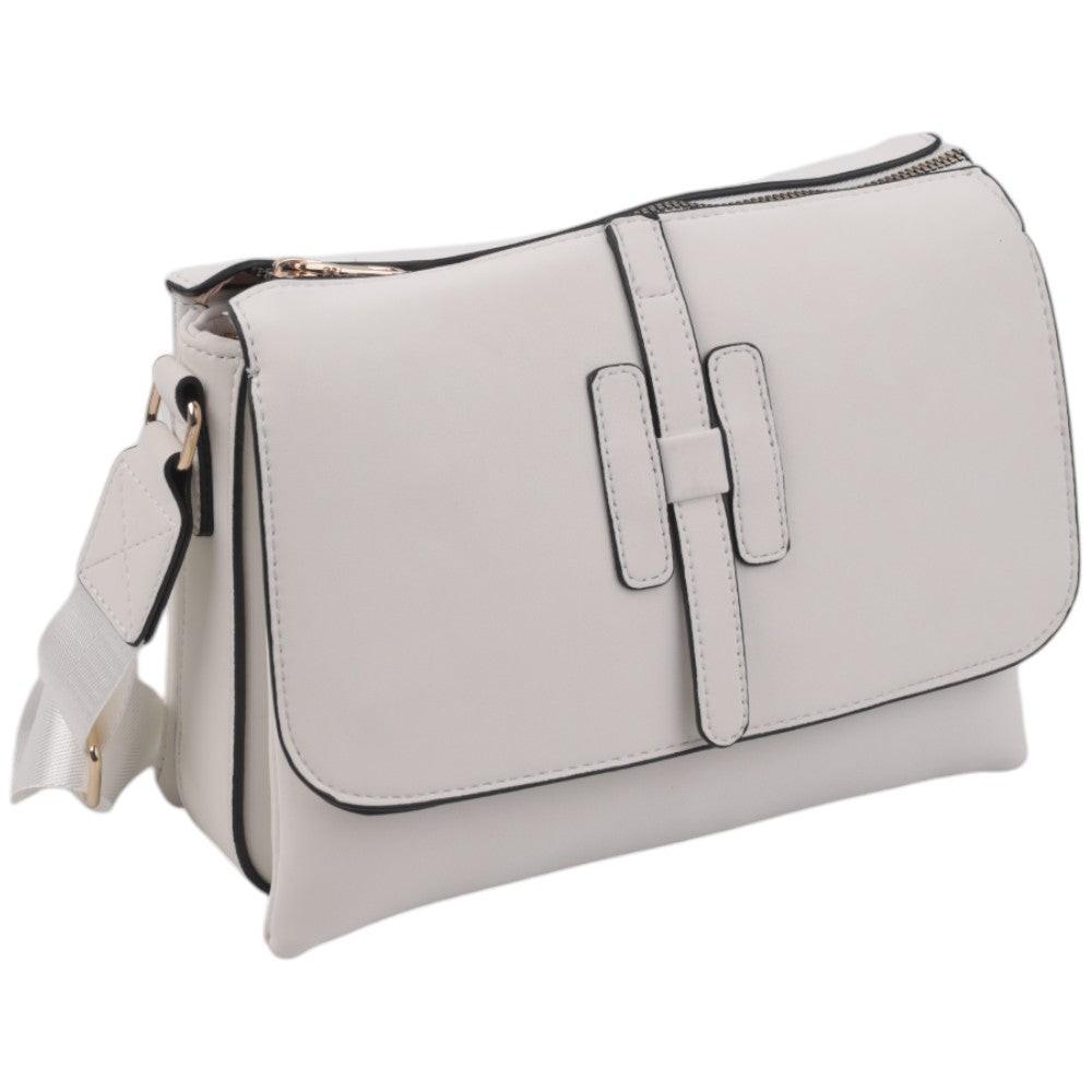 Side view of a light gray handbag featuring a flap closure and adjustable strap against a white background.