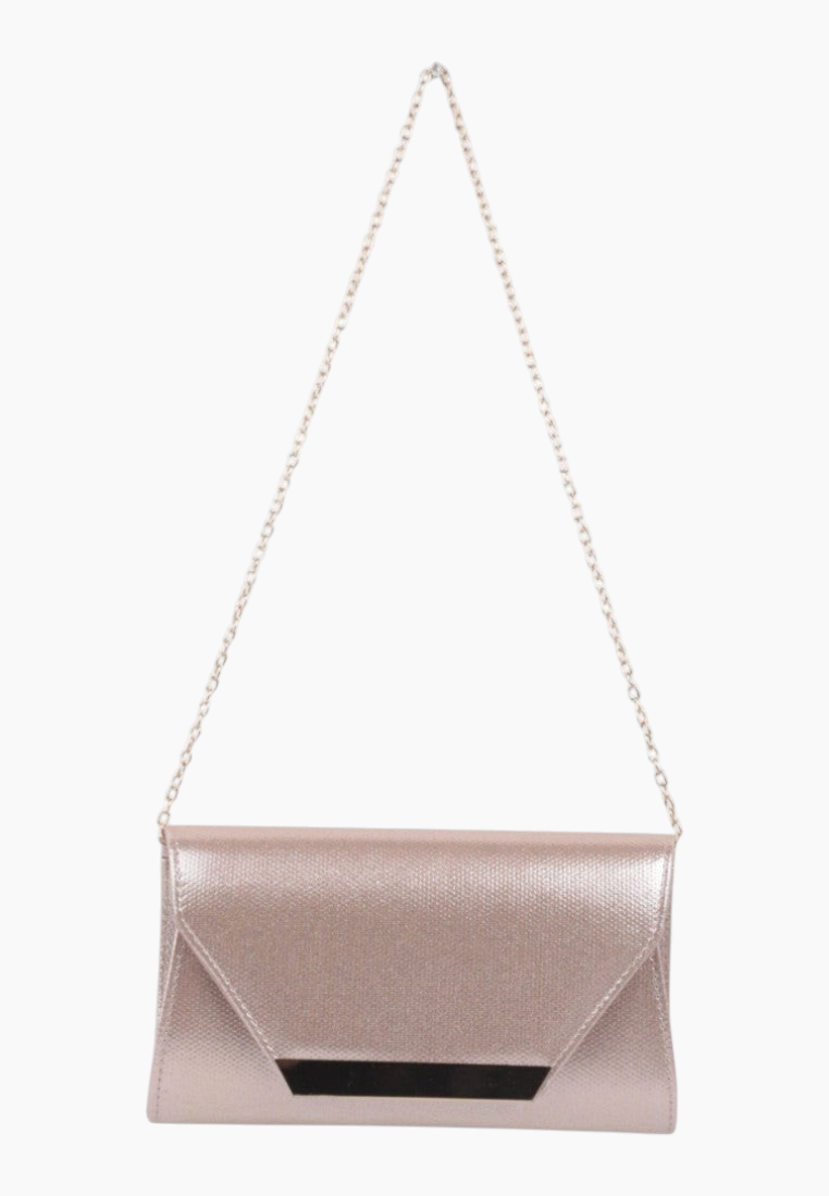 Lifestyle shot of the pink clutch bag with chain strap on a white background