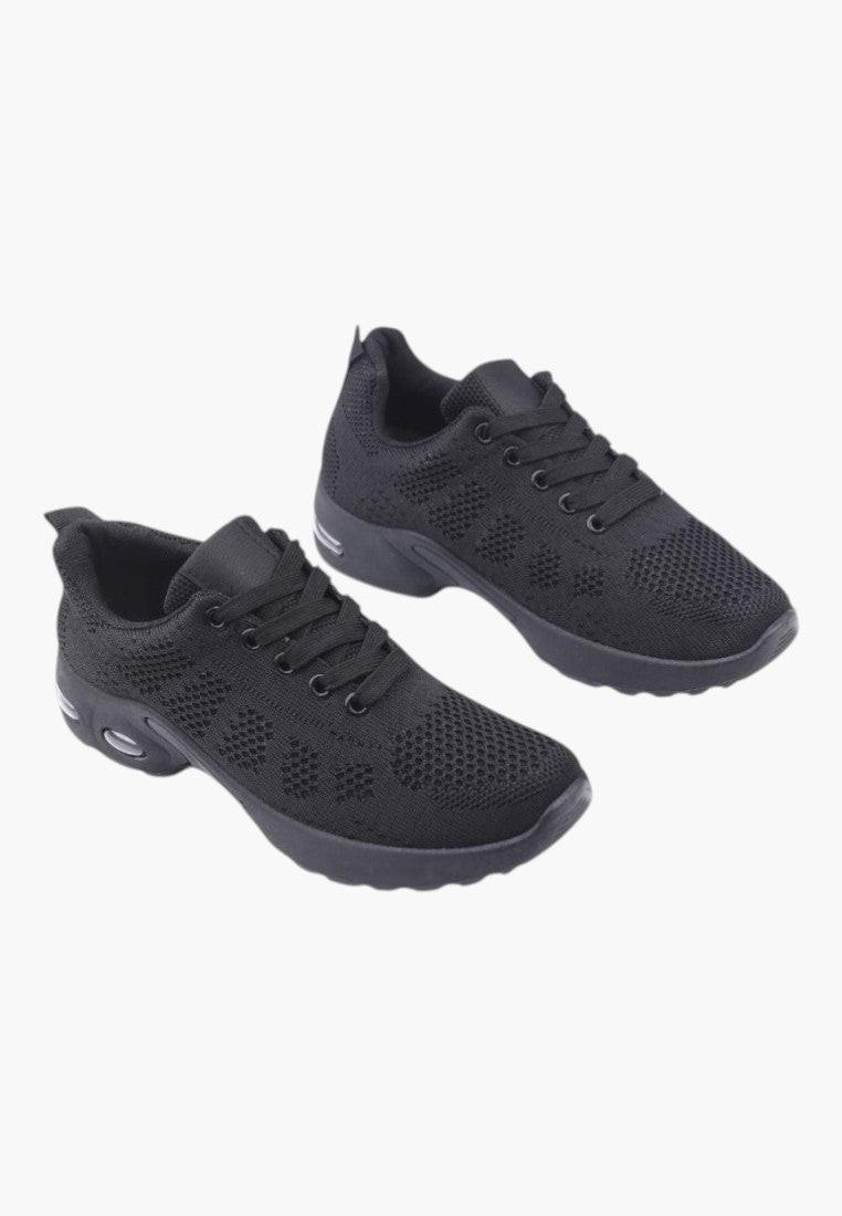 Widok z przodu czarnych sneakersów damskich z okrągłym noskiem.