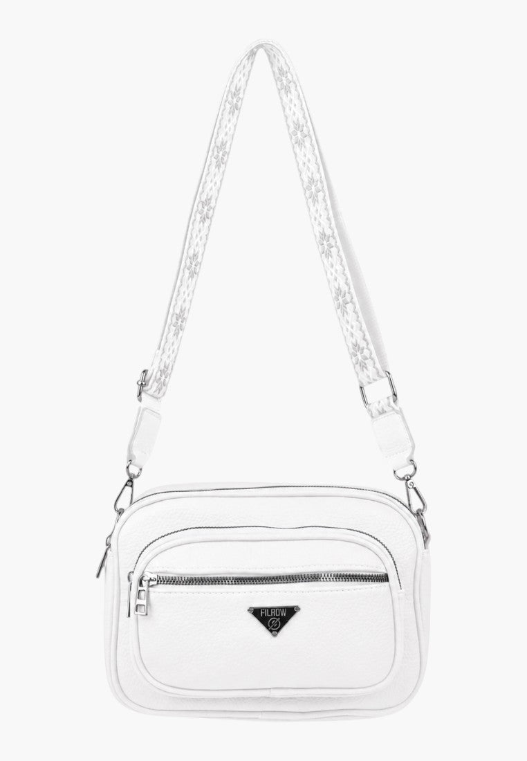 Side view of a white handbag featuring an adjustable strap and logo detail.