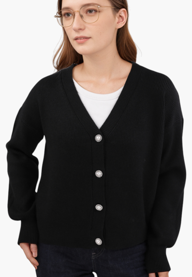 Falio black button-up cardigan with a V-neck, worn by a woman with glasses over a white top.