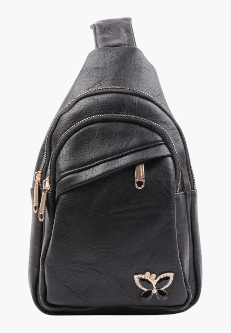 Falio black faux leather urban sling backpack with multiple zippered pockets and a decorative butterfly emblem