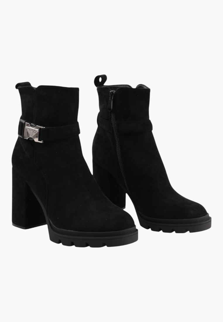 Falio black faux suede ankle boots with a chunky block heel, side zipper, and decorative metallic buckle strap.