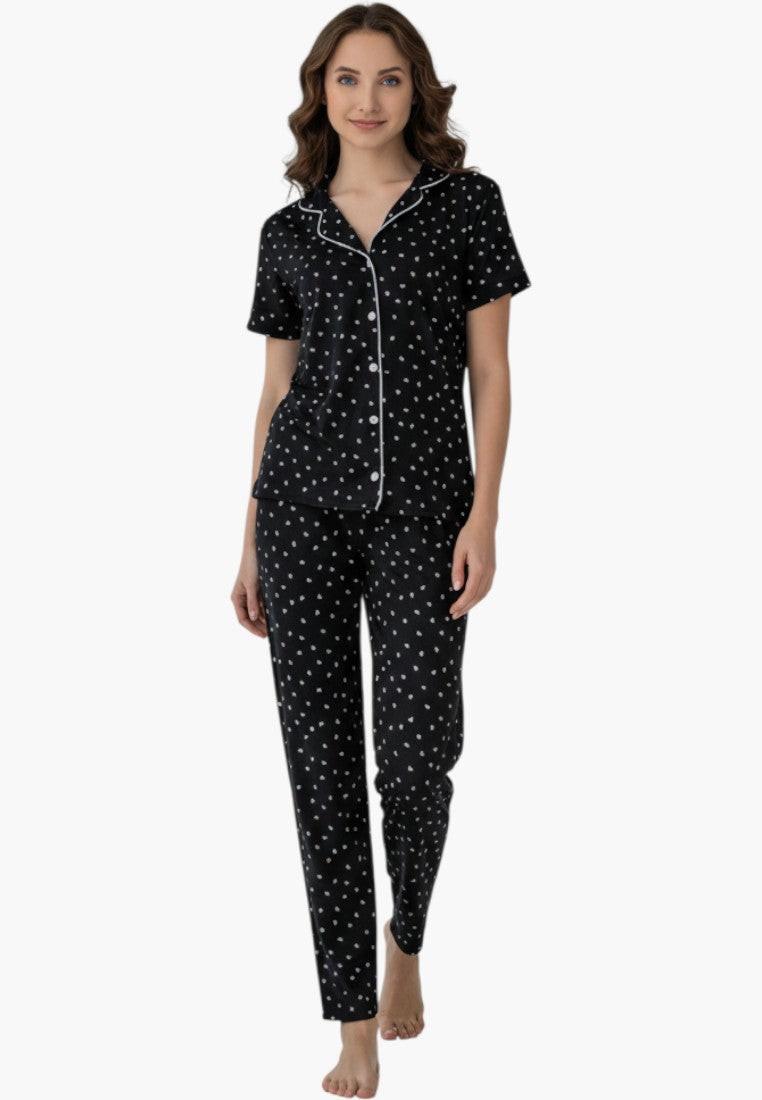Falio black cotton pajama set with white polka dots, short sleeves, and 3/4 length pants.
