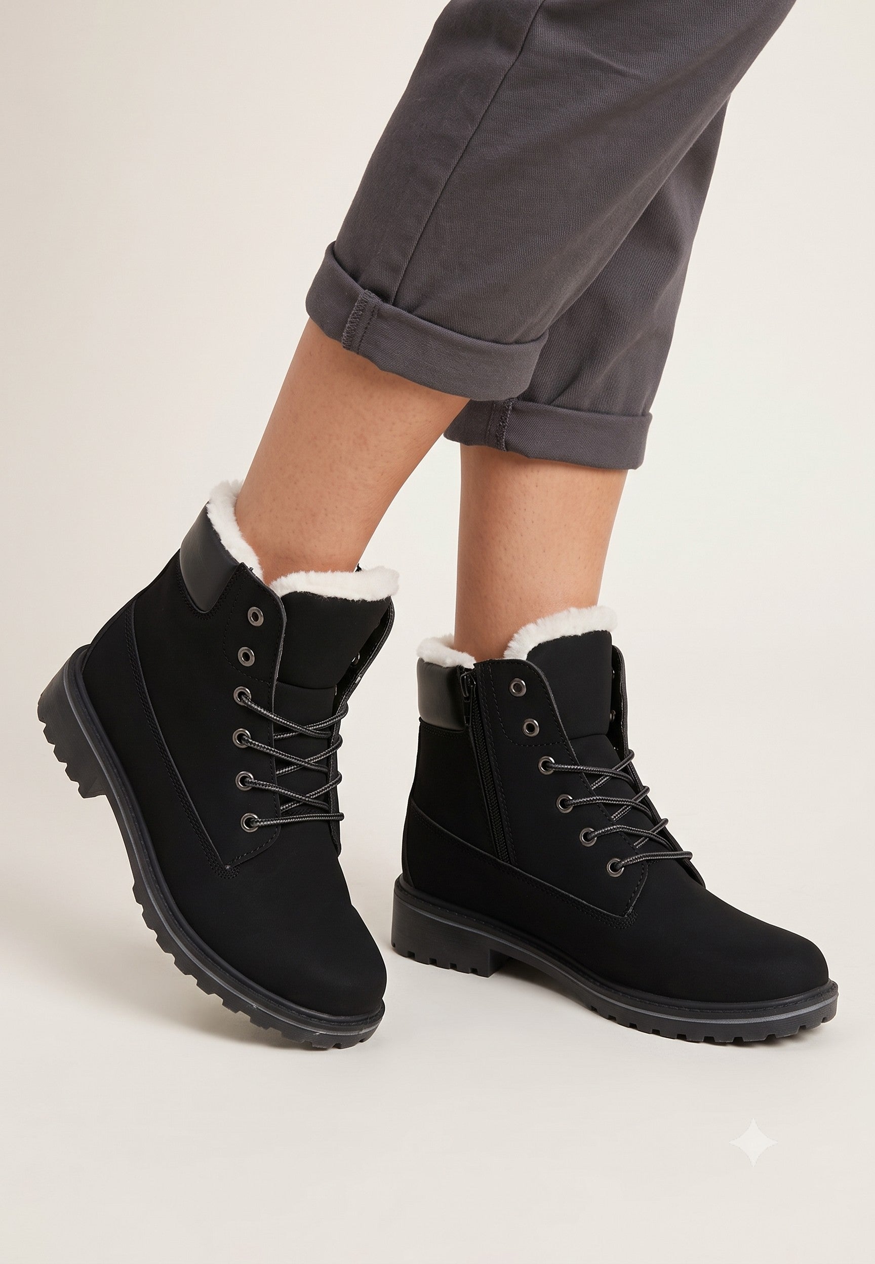 Falio women's black synthetic nubuck winter boots with faux fur lining, lace-up front, and thick lug sole.