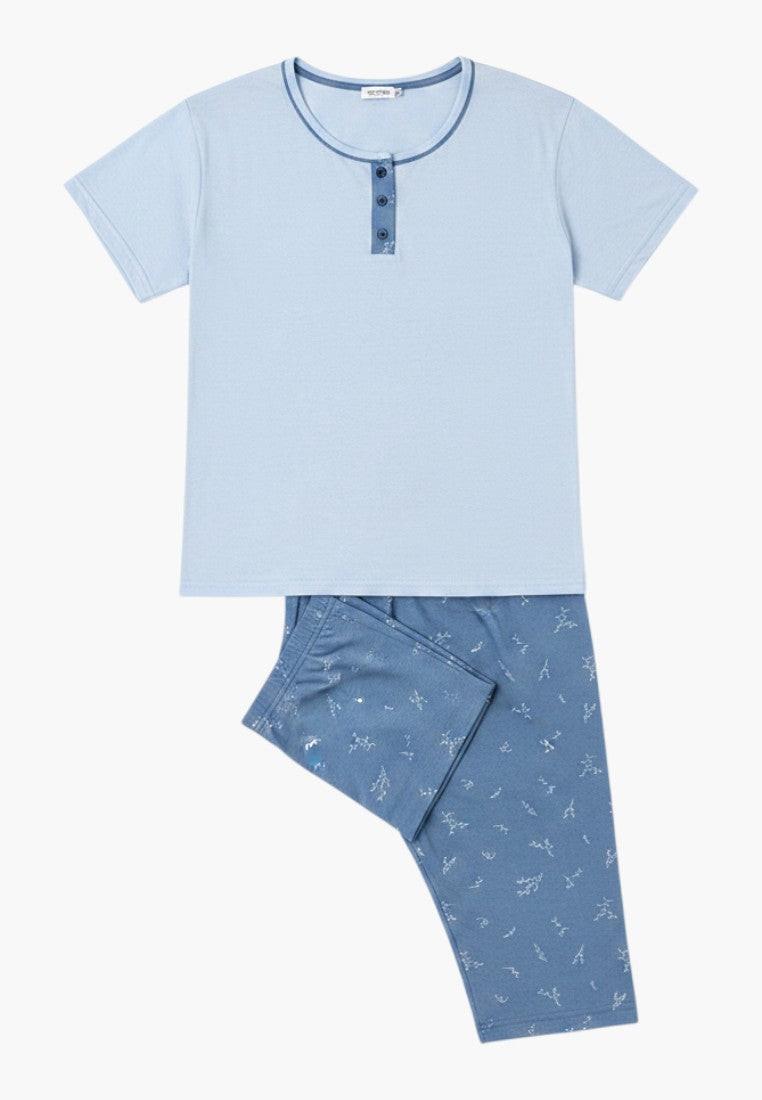 Falio women's light blue 100% cotton short sleeve pajama set with capri pants featuring a subtle white floral print and button neckline.