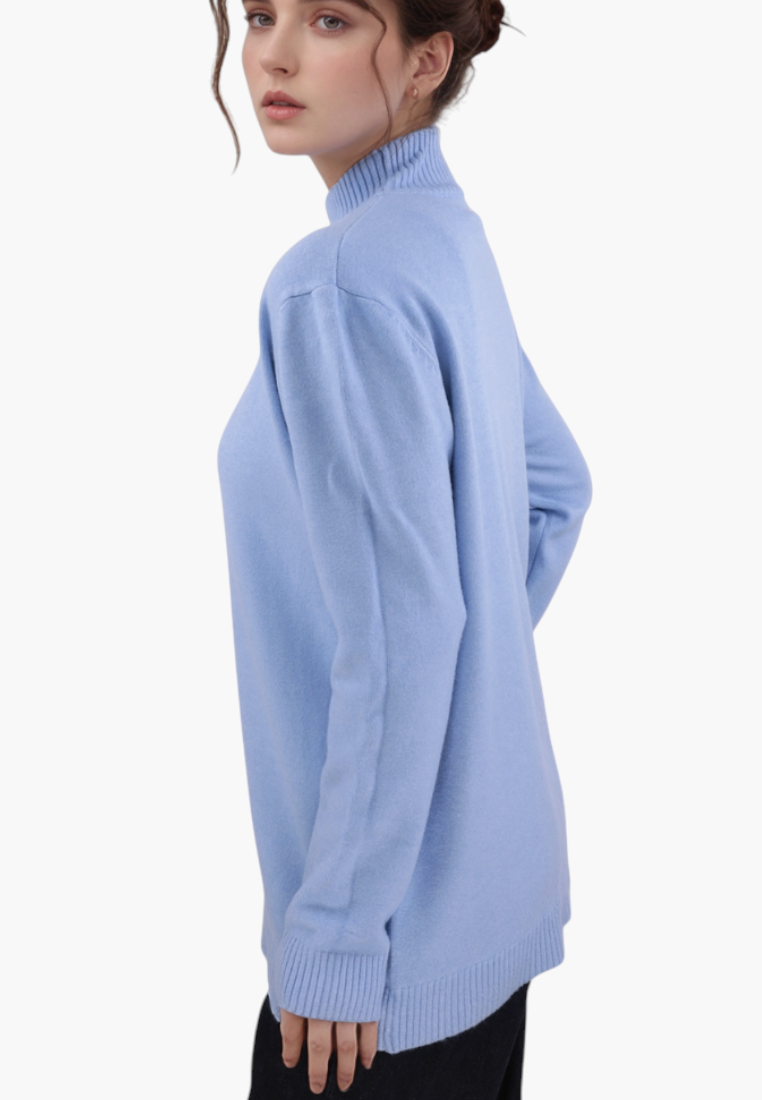 Falio plus size blue mock neck sweater worn by a woman, side view showing ribbed hem and collar details.
