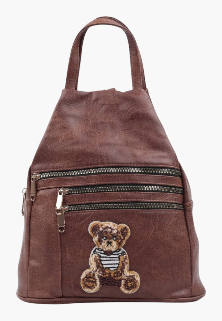 Falio small brown faux leather city backpack with multiple zippered pockets and a cute teddy bear patch