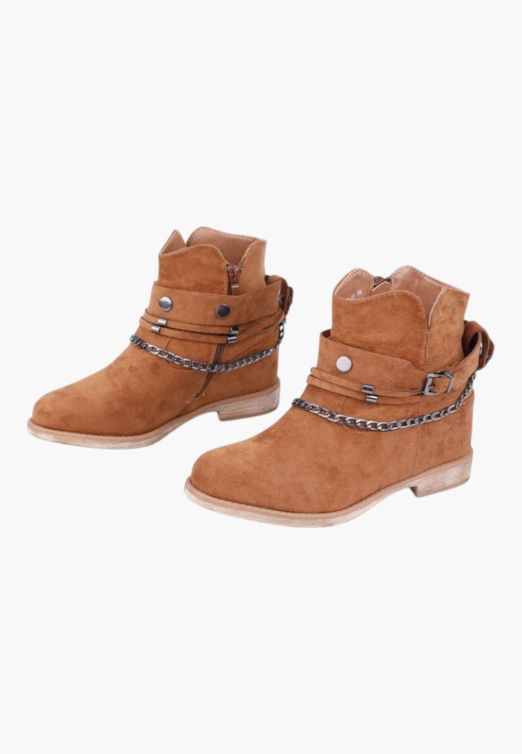 Falio brown faux suede ankle boots with hidden wedge, removable chain and strap details, and side zipper closure.