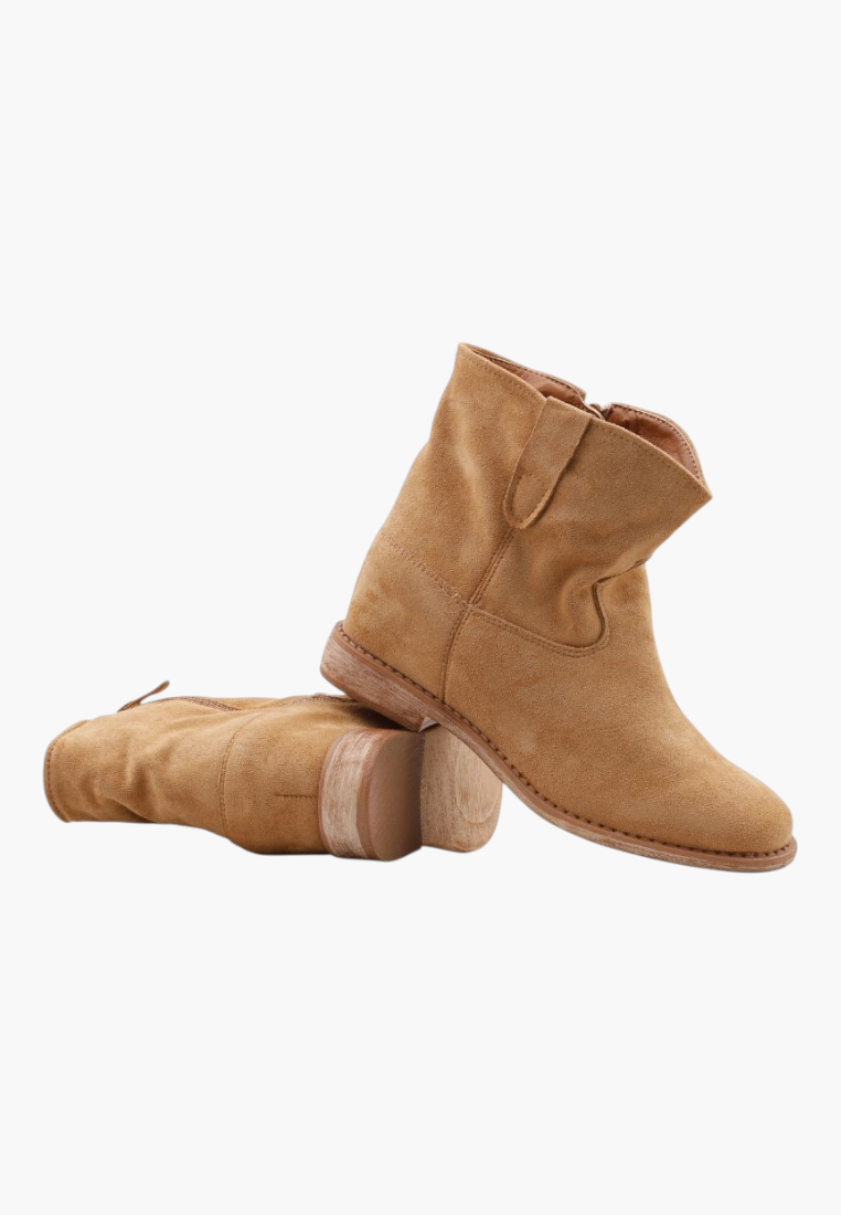 Falio camel brown faux suede ankle boots with a round toe and low heel, featuring a stylish slouchy design.