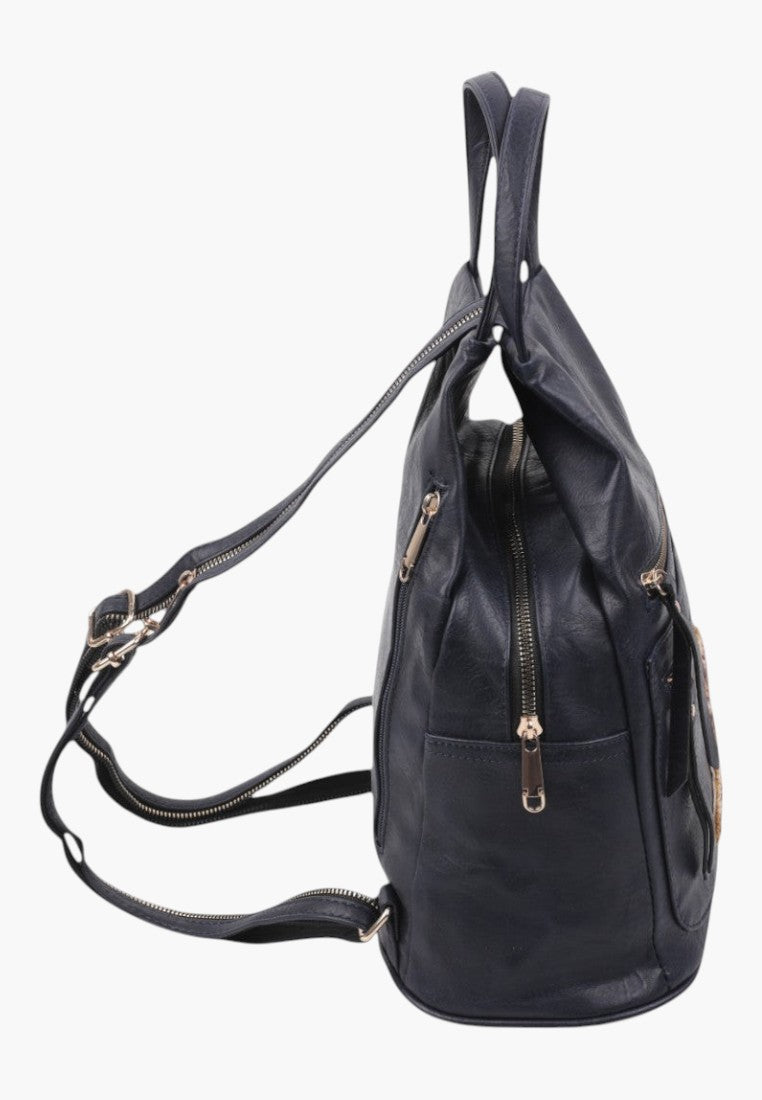Falio urban women's backpack in dark faux leather with multiple zippered pockets, side view