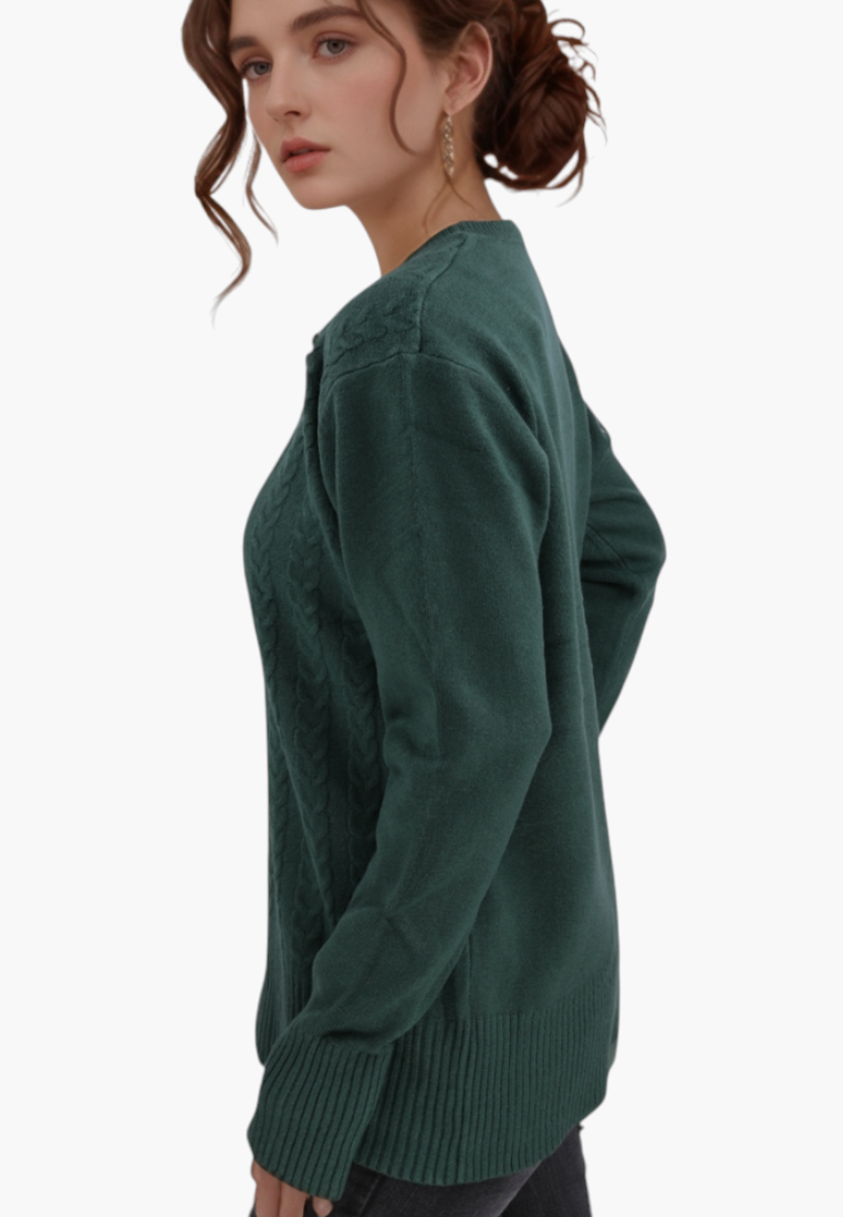 Model wearing a Falio green wool and cashmere blend sweater with a round neckline and cable knit detailing.