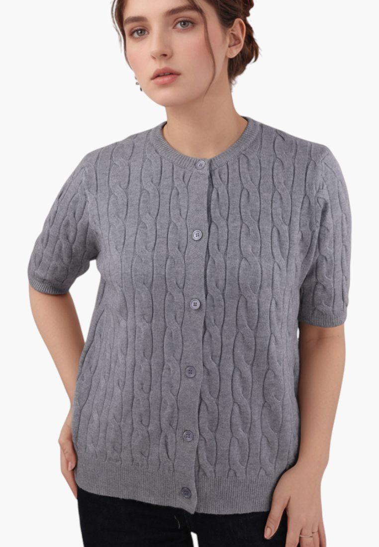 Falio grey cable knit button-up cardigan with a round neckline worn by a woman