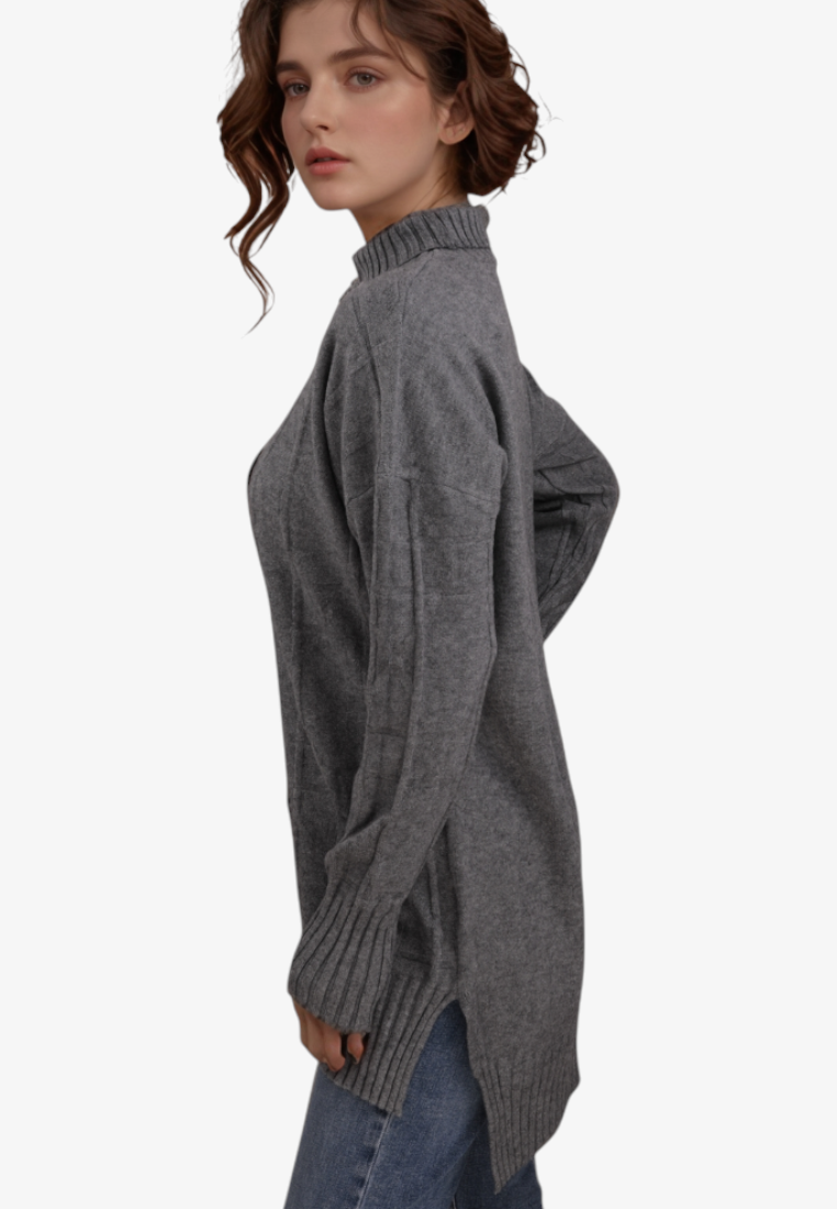 Falio plus size grey mock neck sweater with long sleeves and ribbed cuffs worn by a woman, side view