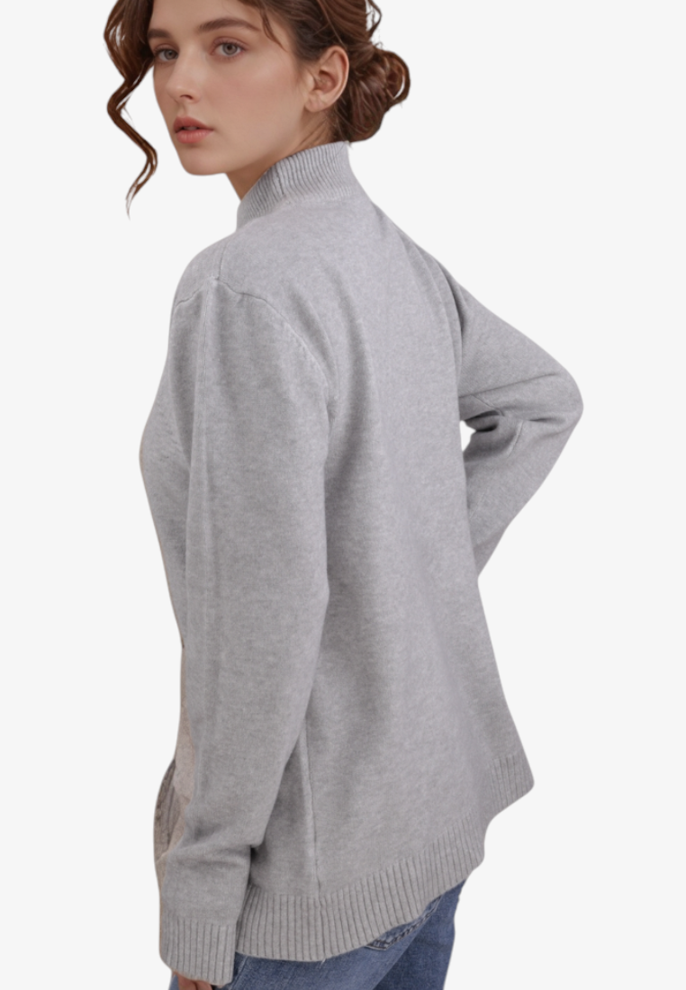 Falio grey wool and cashmere blend mock neck sweater worn by a woman, featuring long sleeves and a classic fit.
