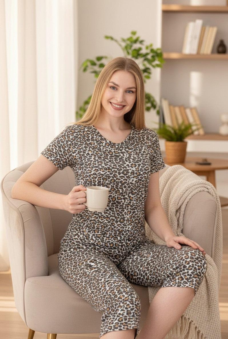 Falio women's two-piece pajama set with short sleeves and 3/4 length pants in a brown and black leopard print, made of 100% cotton.