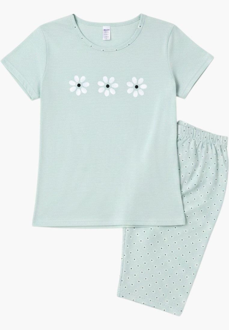 Falio light blue cotton women's pajama set with short sleeves, round neck, and 3/4 length pants with a white polka dot pattern and floral print on the top.