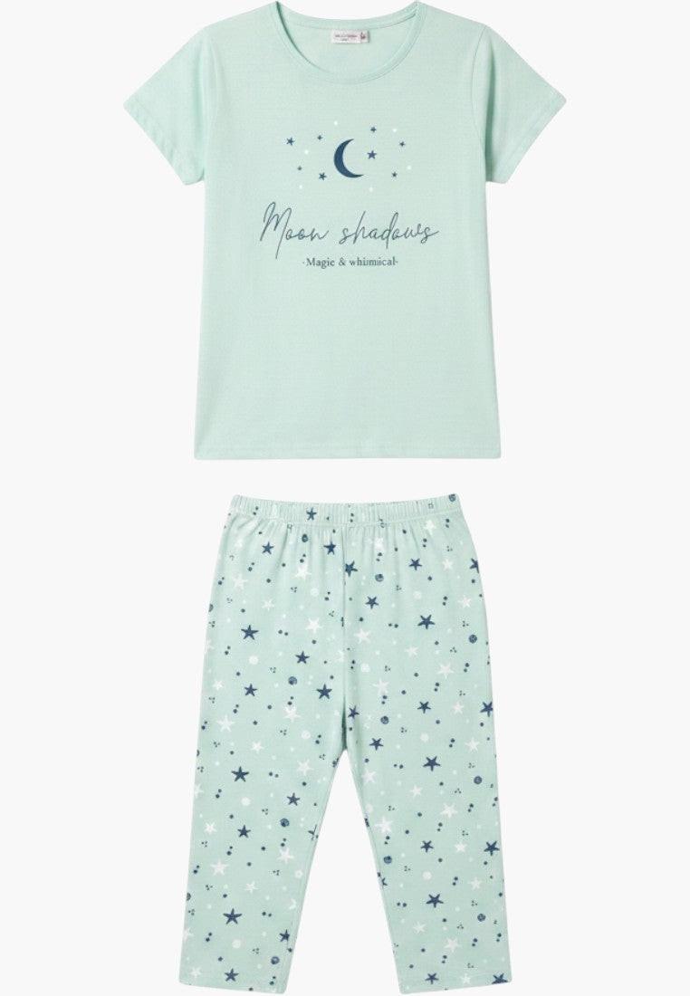 Falio women's light blue cotton pajama set with short sleeves and 3/4 length pants featuring a moon and stars print.