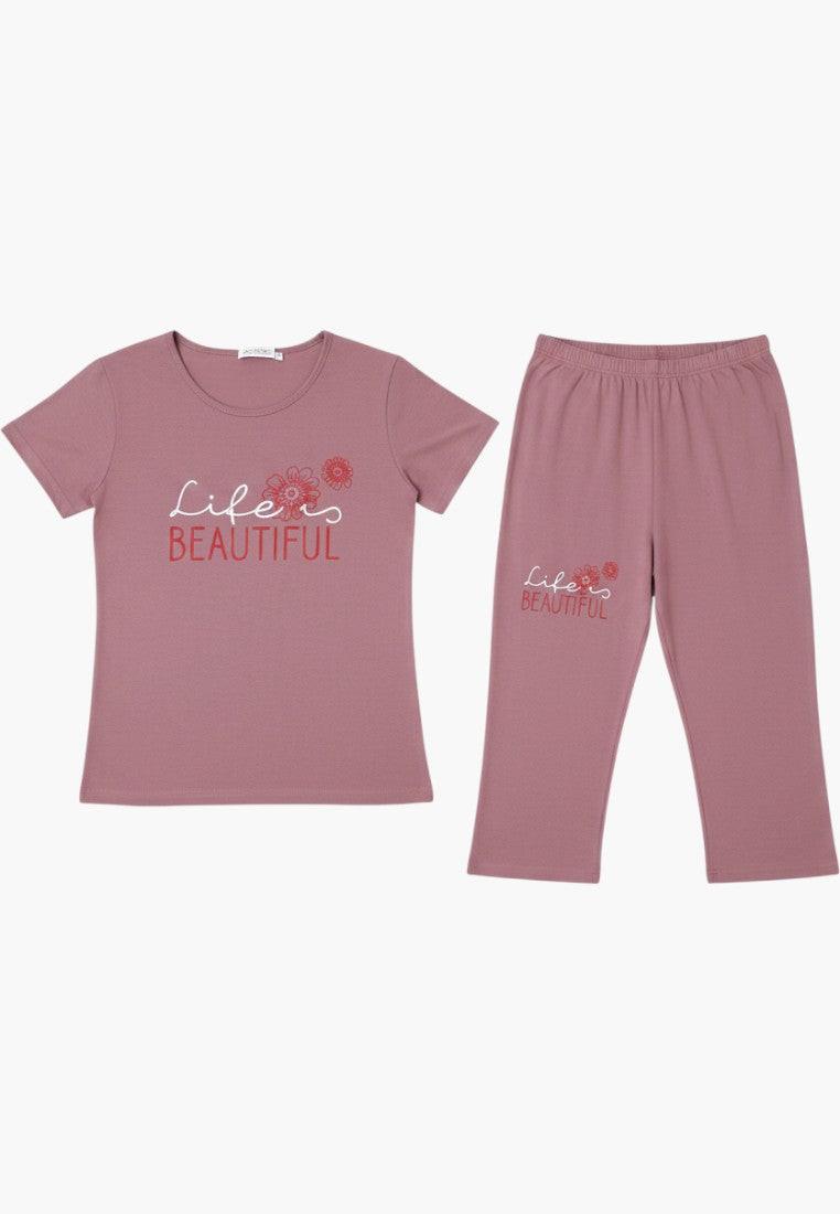 Falio women's mauve cotton pajama set with short sleeves, round neck, and 3/4 length pants featuring a "life is beautiful" floral print.