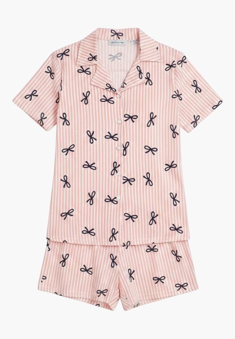 Falio women's pink striped 100% cotton pajama set with navy blue bows. Features short sleeves, collar, button-up top, and short bottoms.