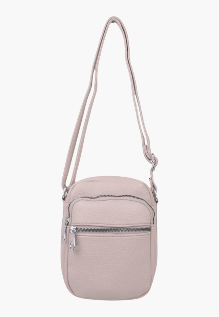 Falio small beige faux leather crossbody bag with a zippered front pocket and adjustable shoulder strap