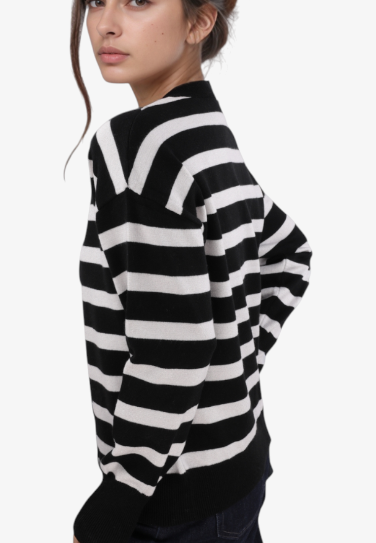 Falio black and white striped viscose blend sweater with round neck worn by a model in a side profile view