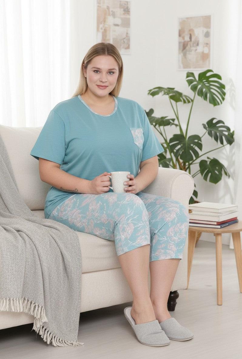 Falio women's plus size teal cotton pajama set with short sleeves, round neck, and floral print capri pants.