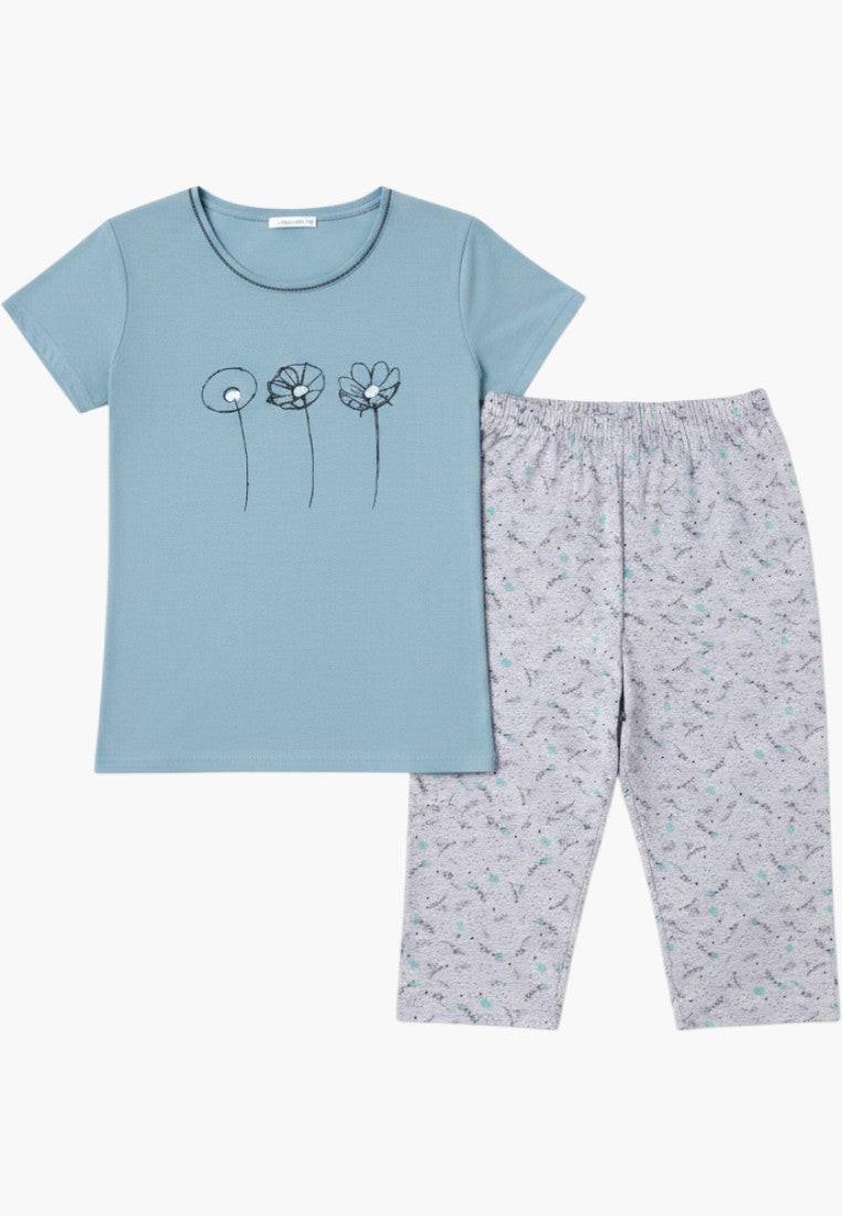 Falio women's blue cotton pajama set with short sleeves and 3/4 length pants featuring a floral print and round neckline.