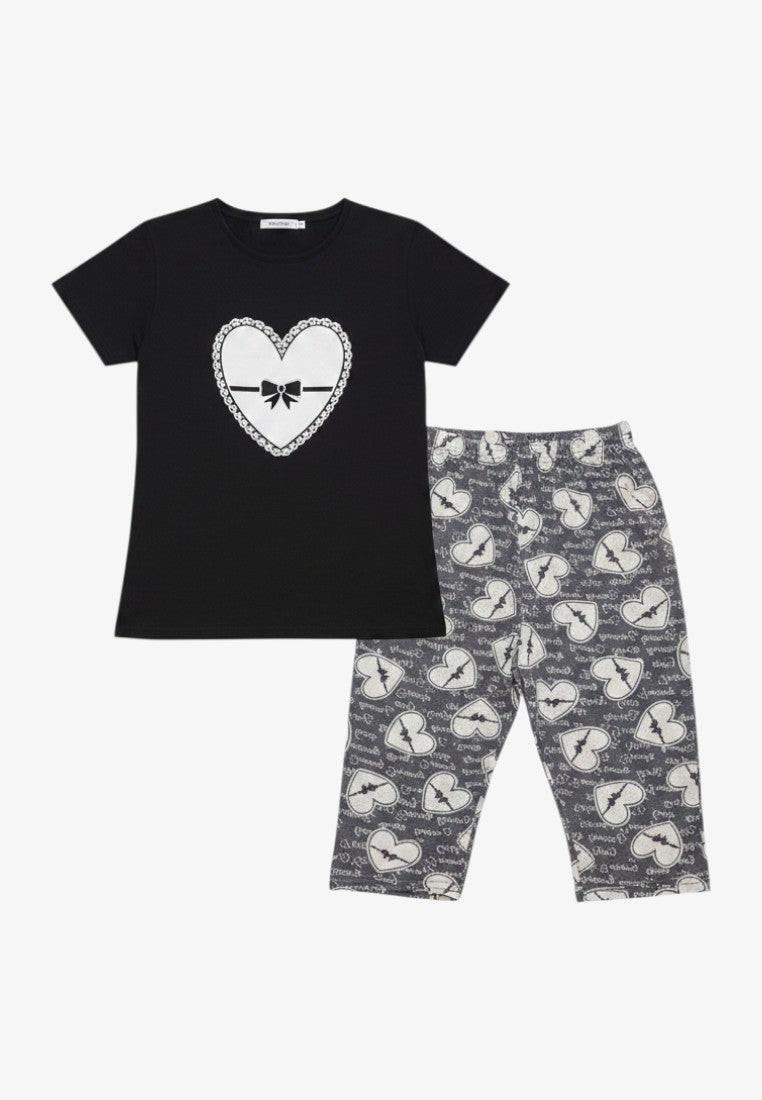 Falio women's black cotton pyjama set with short sleeves and 3/4 length patterned shorts featuring hearts.