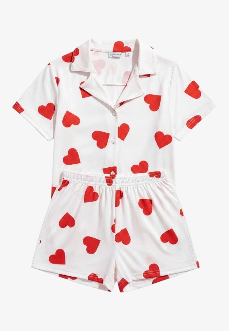 Falio white 100% cotton women's pajama set with red hearts, short sleeves, shorts, and V-neck.