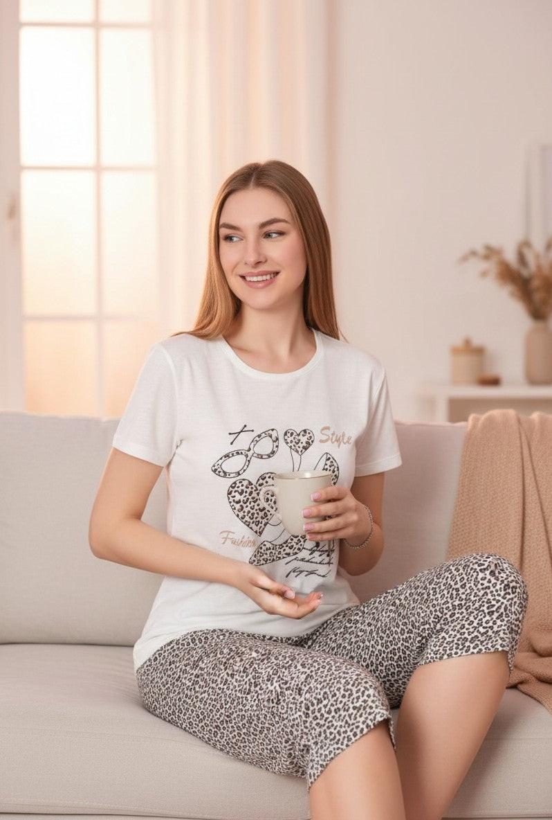 Falio white cotton t-shirt with short sleeves and leopard print shorts, featuring a graphic of a high heel and hearts.