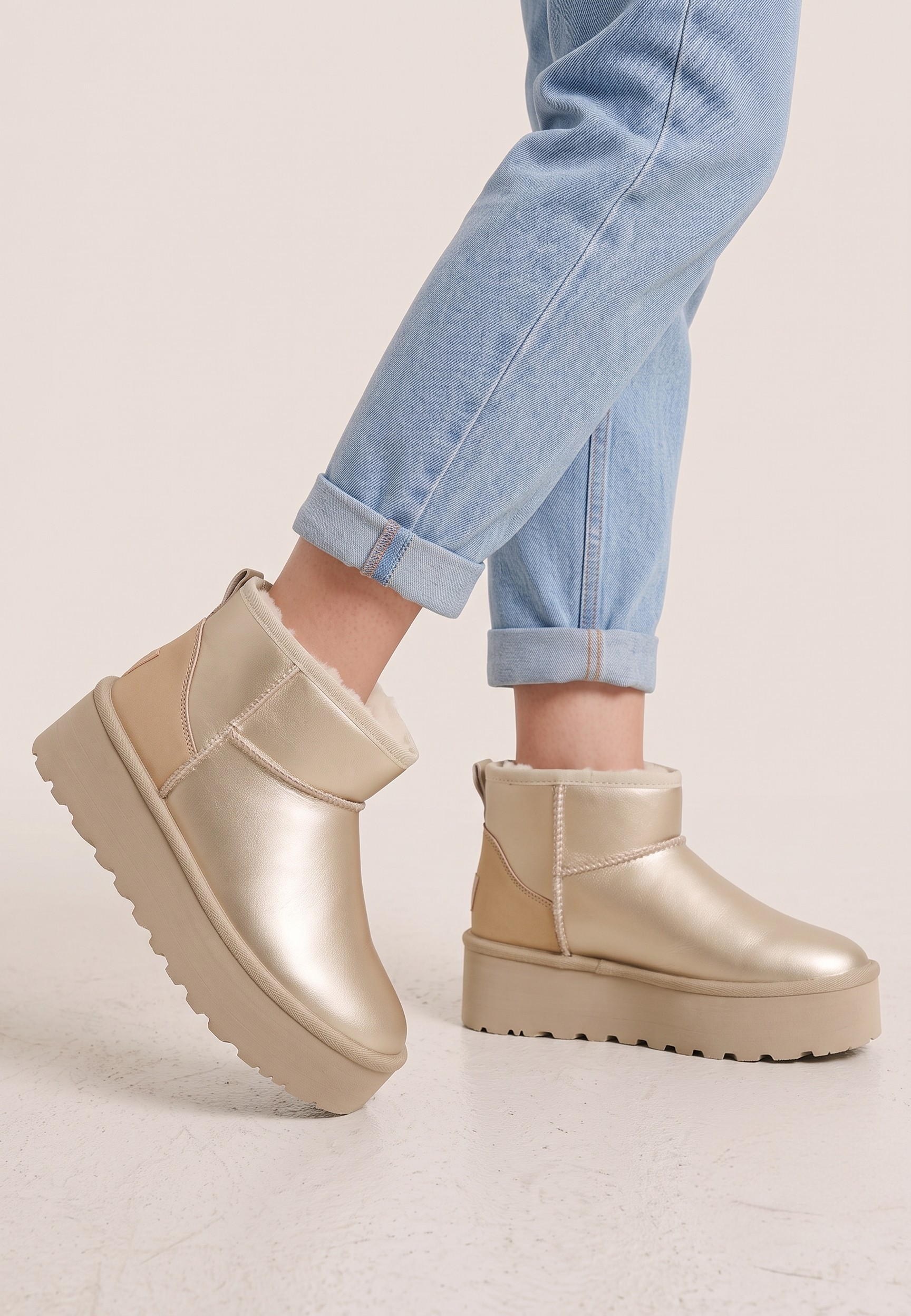 Falio yellow metallic faux leather slip-on ankle boots with warm lining and thick platform sole worn with jeans