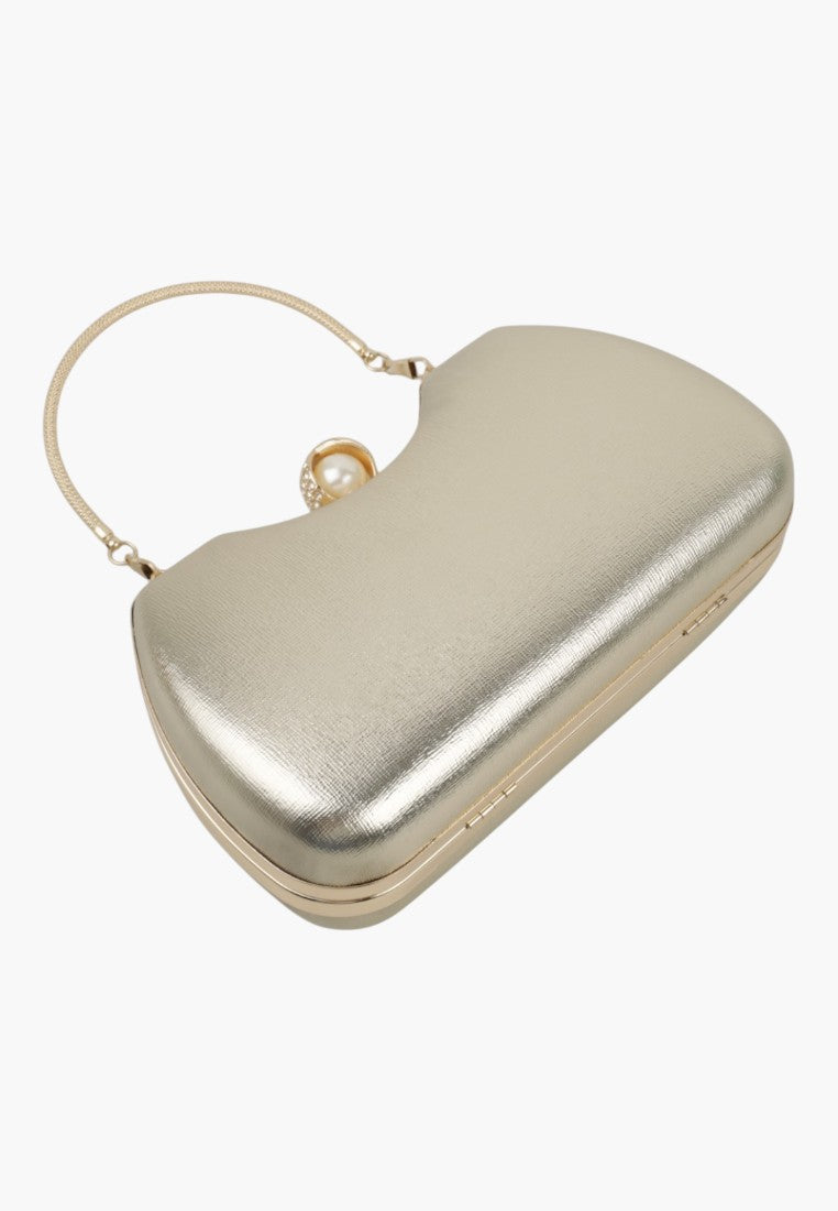 Back view of a silver handbag with a smooth finish and top handle on a white background.