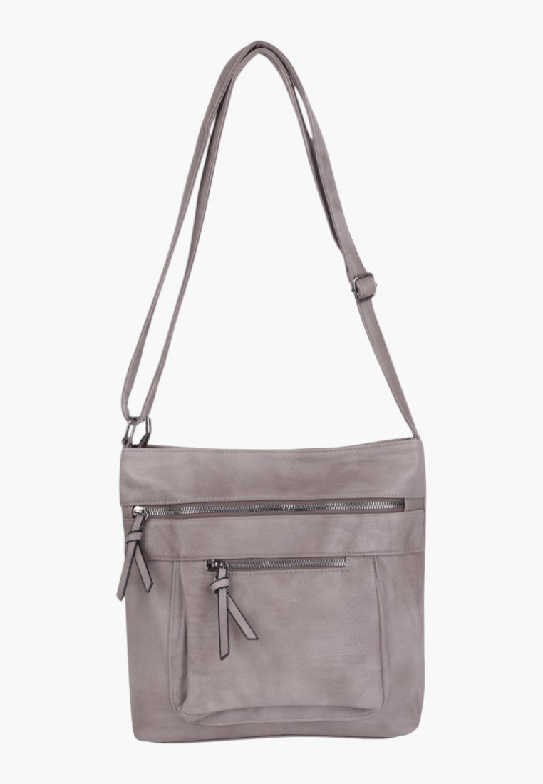 Back view of a grey faux leather crossbody bag featuring an adjustable strap.