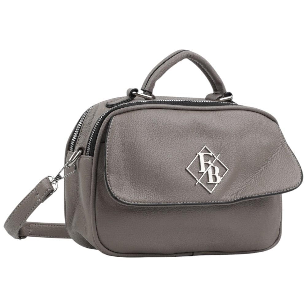 Front view of the gray handbag with flap closure and logo detail on a white background.