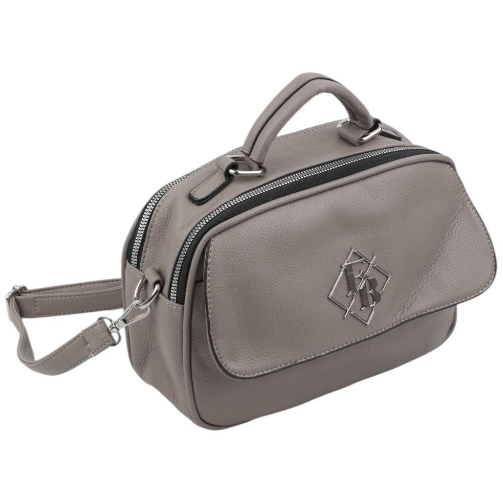 Side view of the gray handbag featuring zipper closure and top handle on a white background.
