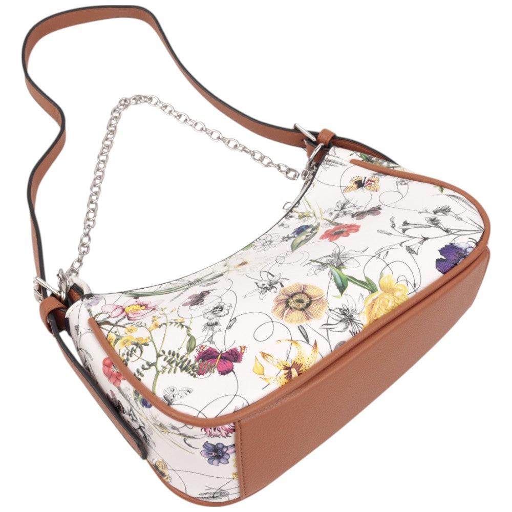 Side view of a floral handbag featuring a rounded shape in white, brown, and multicolor.