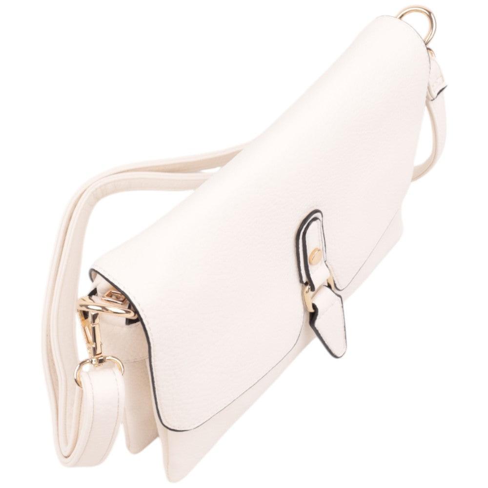 Side view of a white handbag featuring a flap closure and gold hardware.