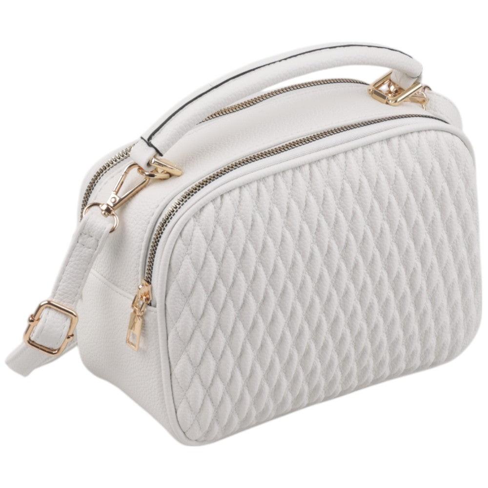 Side view of a white handbag featuring a double zipper and gold hardware.