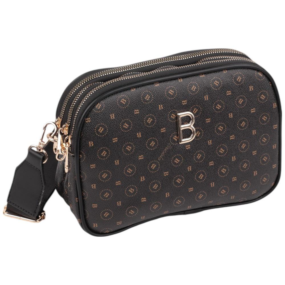 Side view of the black patterned bag showcasing its zipper closure and logo detail.
