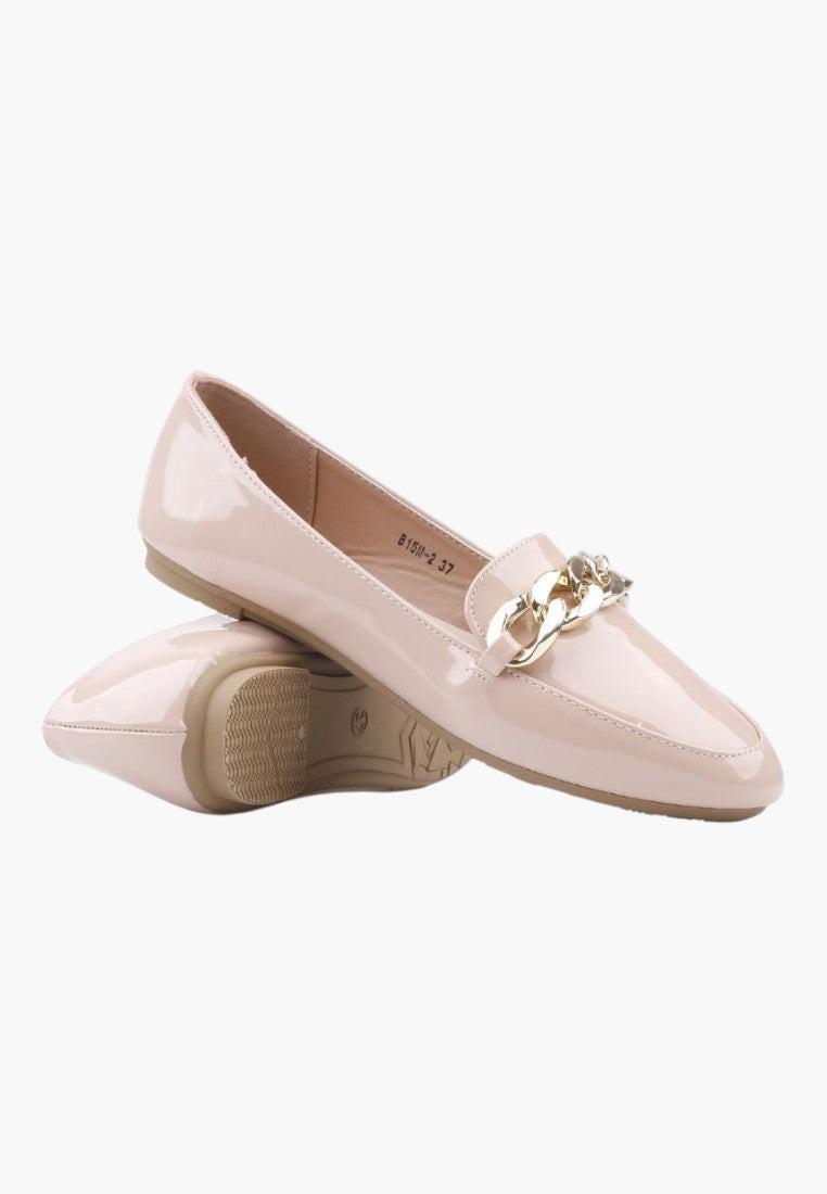 Side view of pink slip-on shoes with wedged sole and gold chain detail.