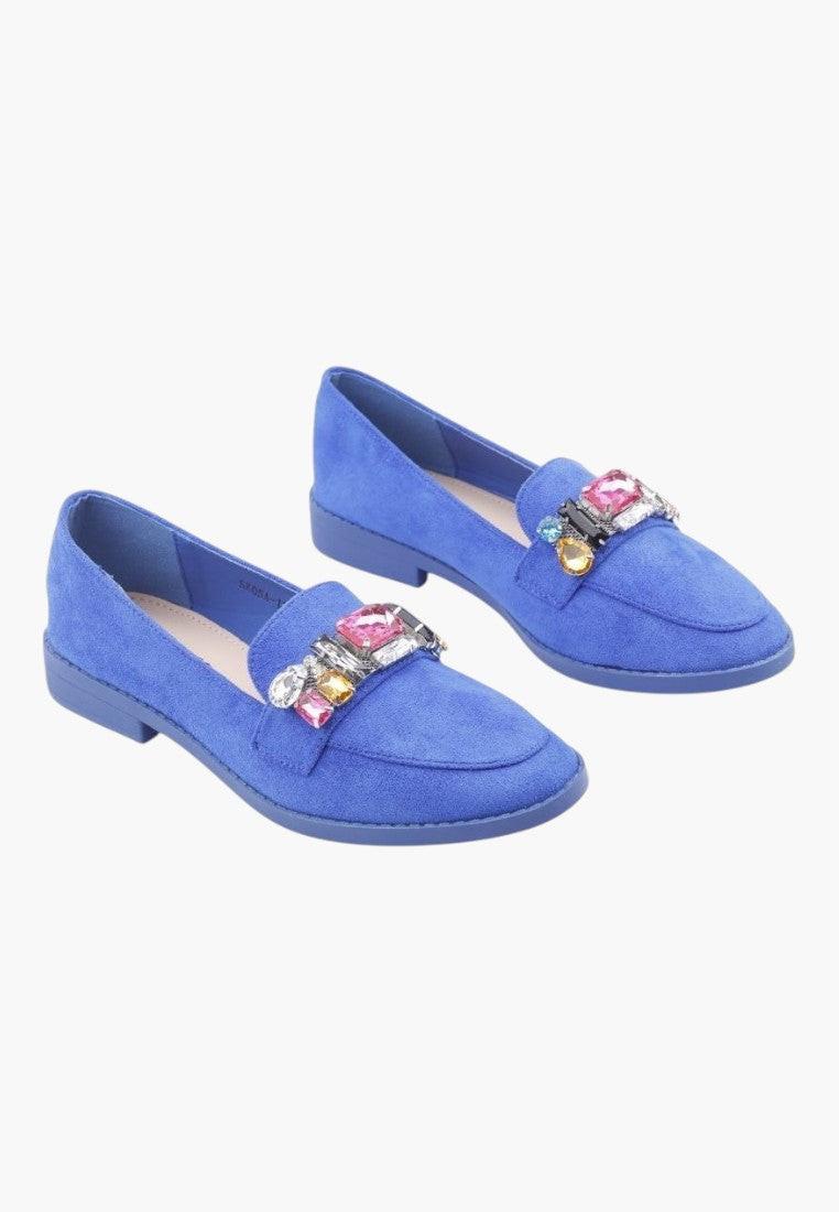 Front view of blue moccasin shoes with decorative details on a white background.