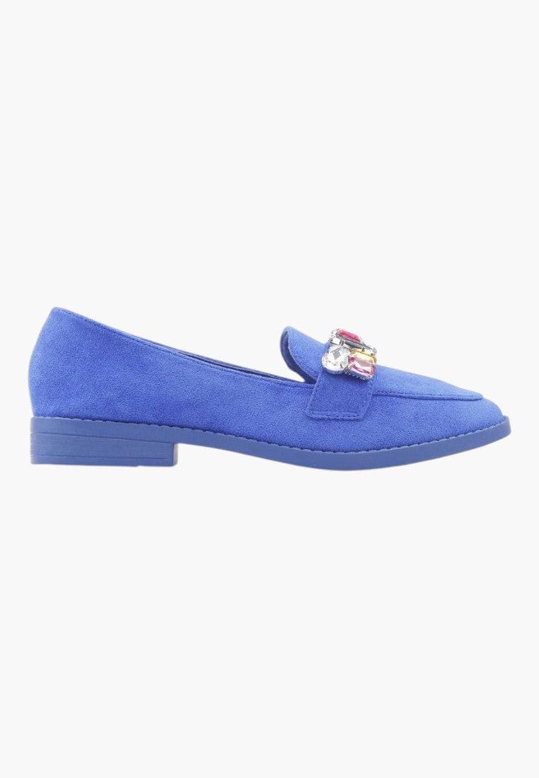 Side view of blue moccasin shoes showcasing elegant design and flat heel.