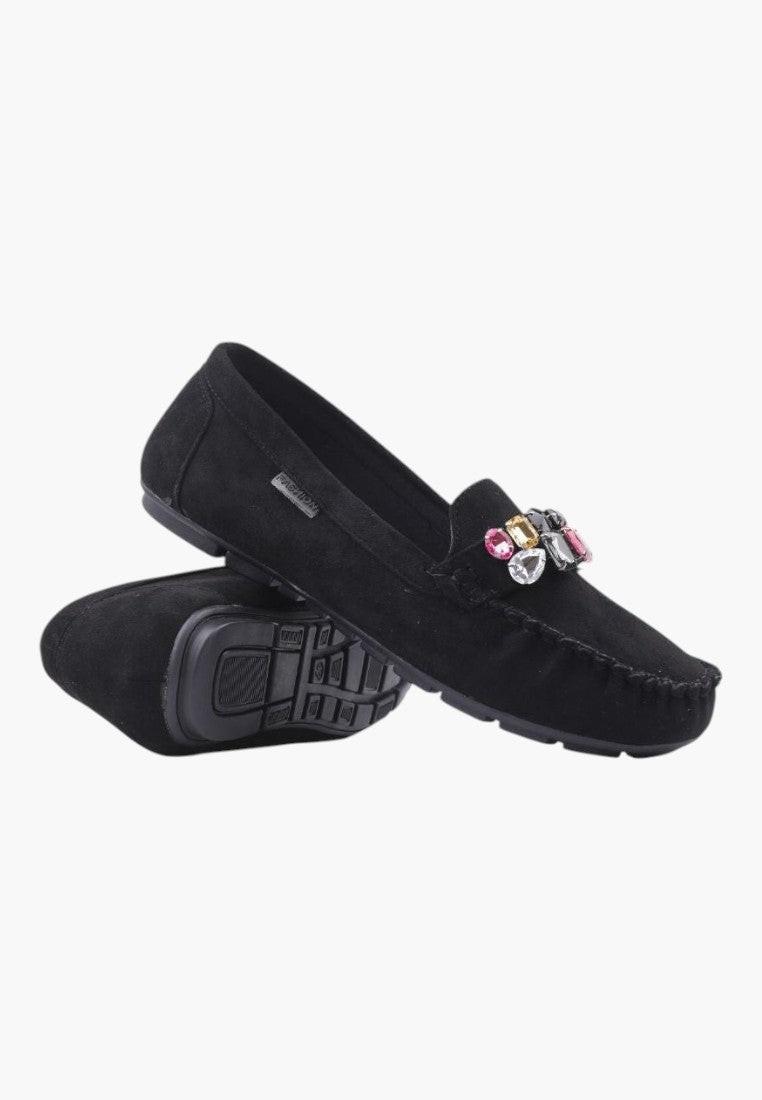 Side view of black suede women's moccasins featuring a decorative bow.