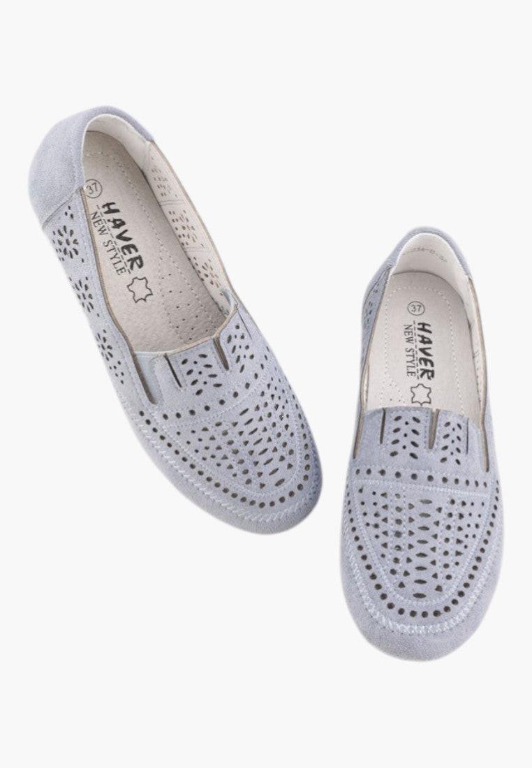 Detail close-up of blue perforated moccasins with elastic sides.