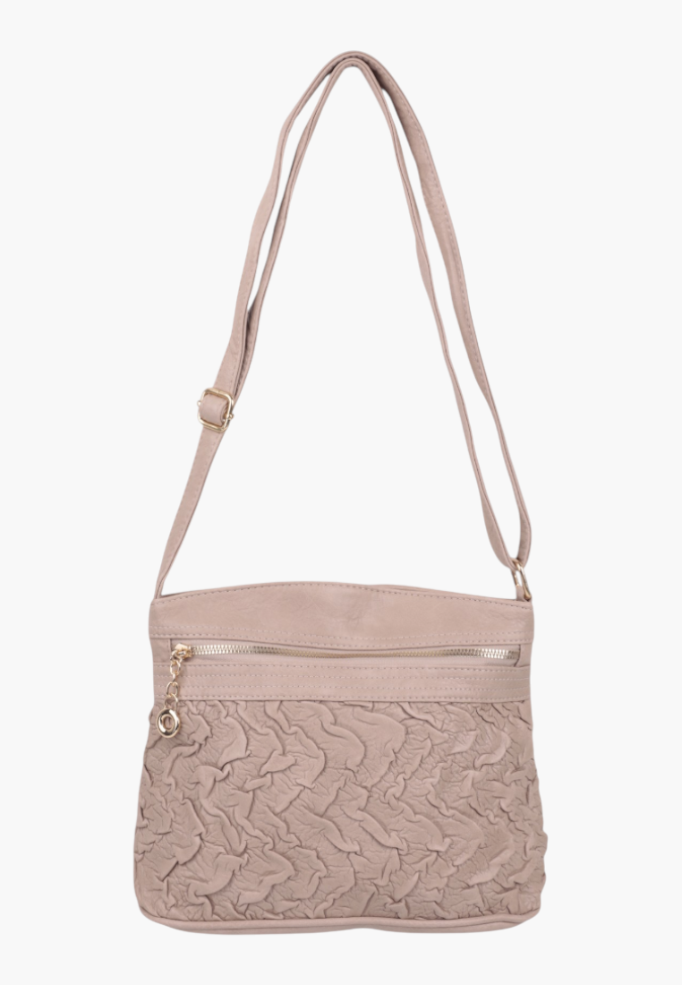 Front view of a beige handbag featuring an adjustable strap and front pocket.