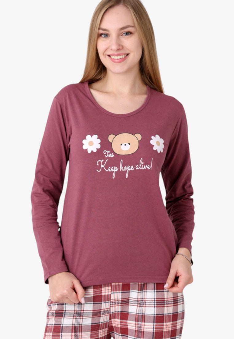 Detail view of a long-sleeve burgundy pajama top with a cute bear and floral print.