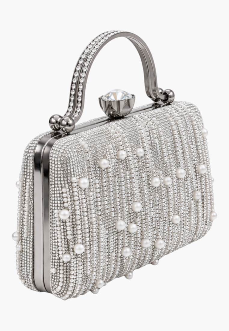 Side view of the silver beaded clutch bag showcasing the top handle and rhinestone clasp.